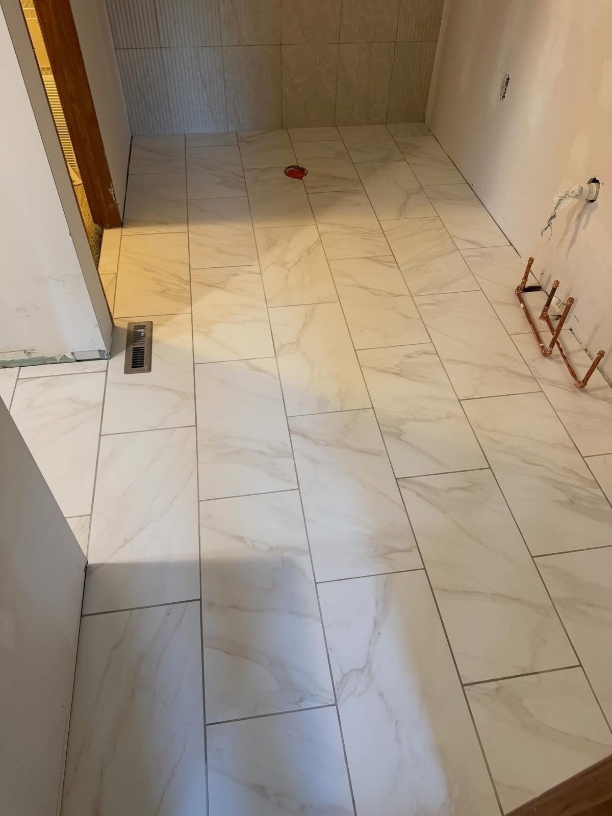 Marble-look tile bathroom floor installed in a Centerville, OH home