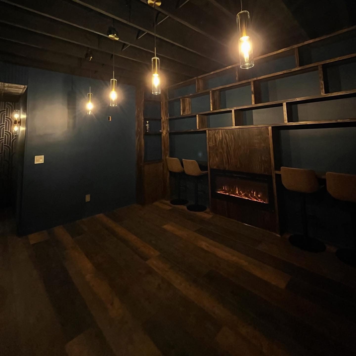 Dark LVP flooring installed in a finished basement lounge in Dayton, OH